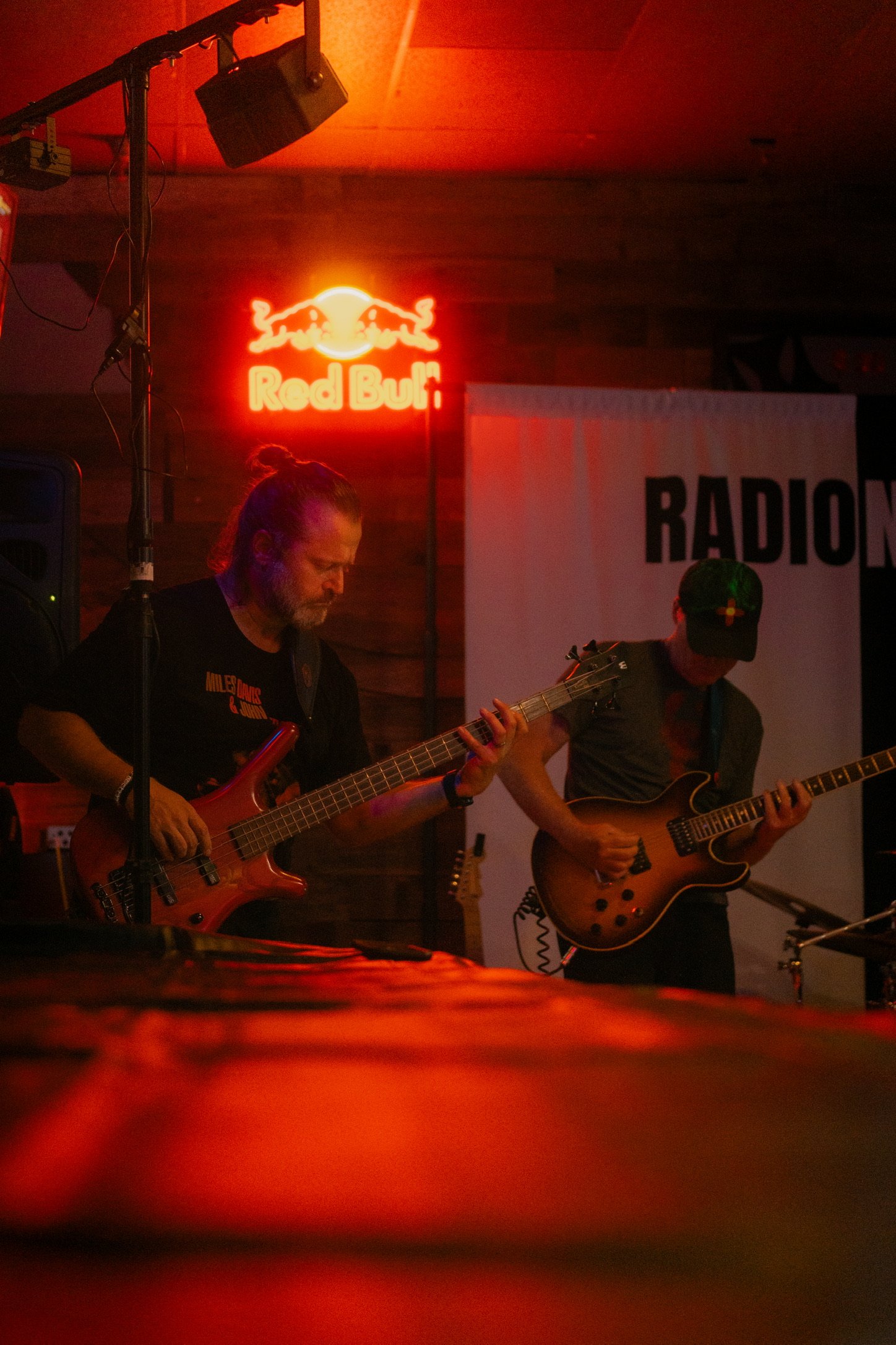 bass player and lead guitarist of Radio NotRadio playing on stage